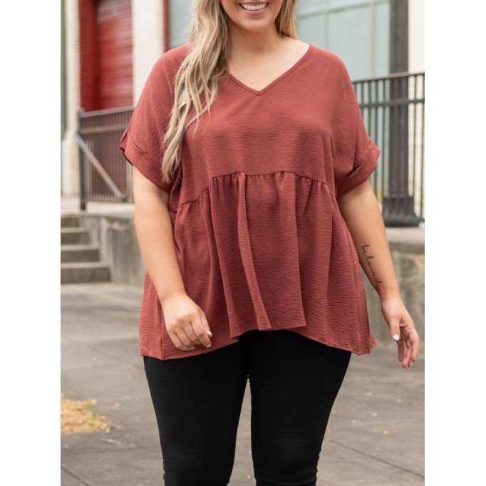 V-neck short sleeved shirt with ruffle hem