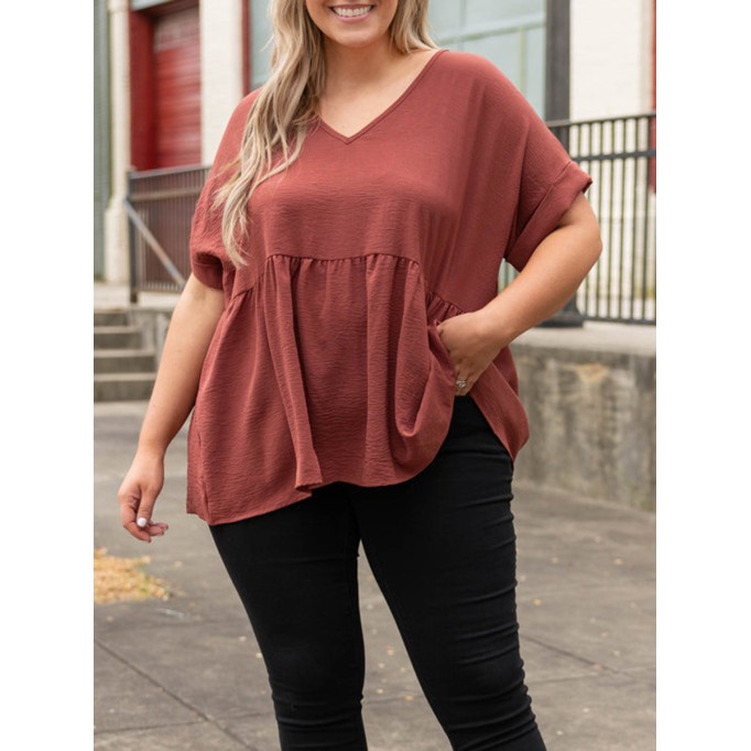 V-neck short sleeved shirt with ruffle hem